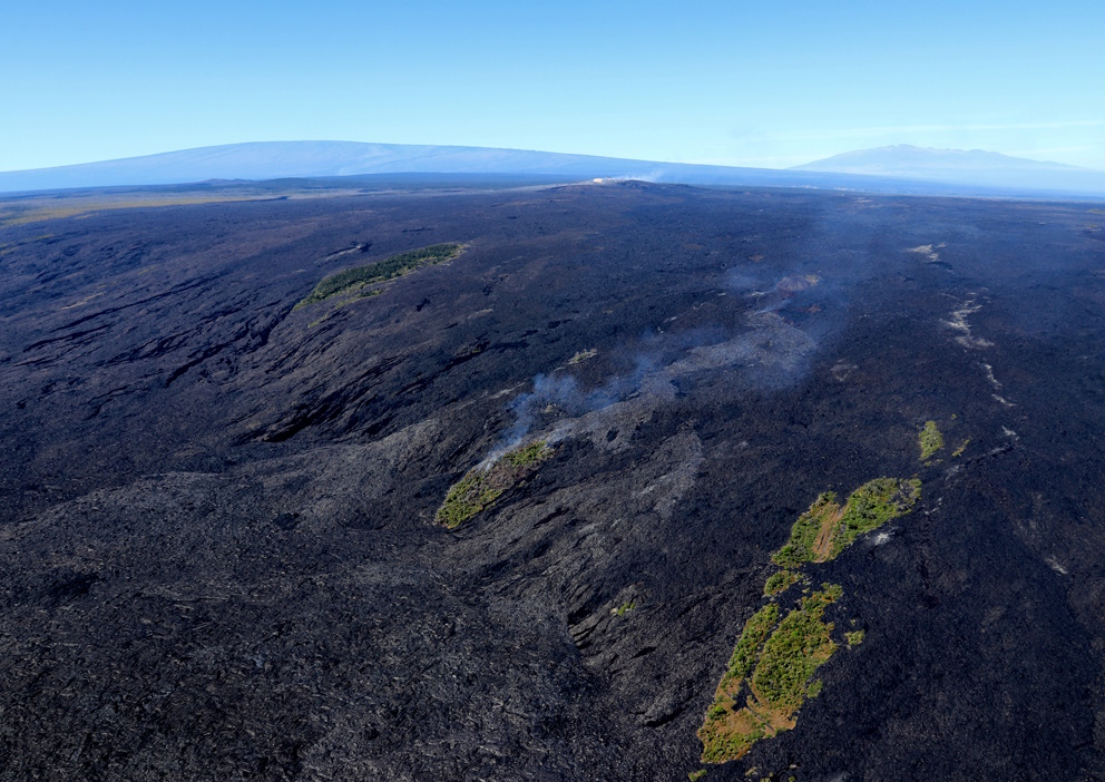 Spectacular aerial view of Kīlauea Volcano's East Rift Zone lava flows advancing over Pūlama pali in December 2017. USGS photo by C. Parcheta.